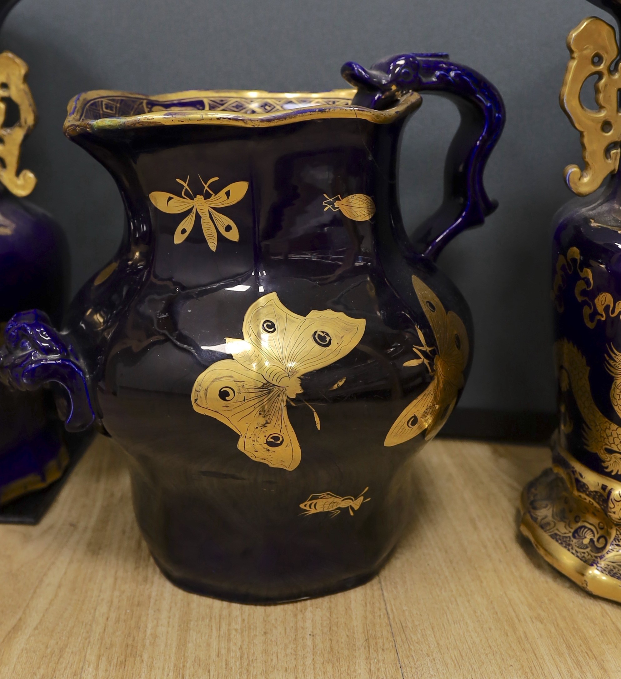 A large early 19th century Masons ironstone cobalt blue and gilt decorated jug and two similar large vases, tallest 37cms high